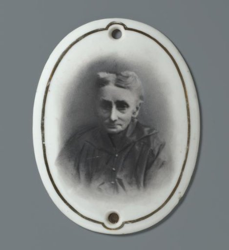 Portrait of an unknown old woman on a ceramic oval plaque from a grave