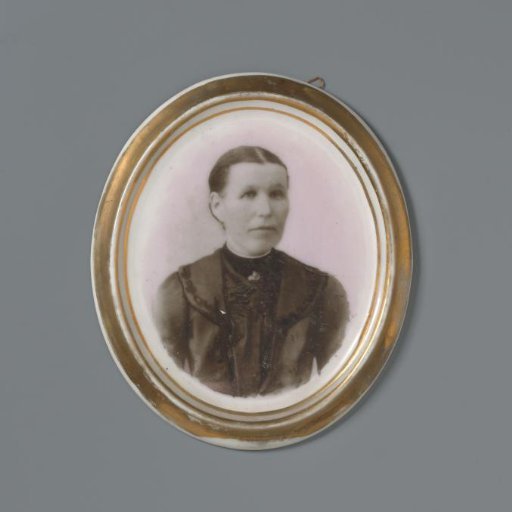Portrait of an unknown woman on an oval porcelain plaque from a grave