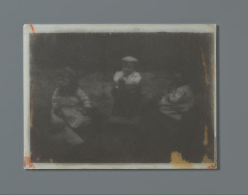 Three toddlers in a garden with toys, a rocking horse and wheelbarrows with a shovel, probably the twins Ad (left) and Johanna (right), and Han (middle) van der Kop