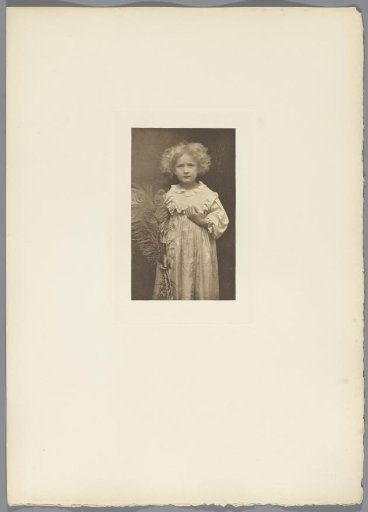 Portrait of an unknown child with a peacock feather