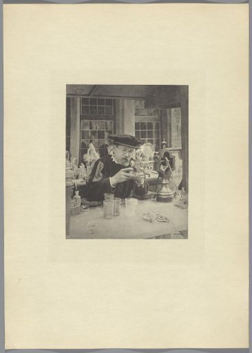 Man engraving on glass