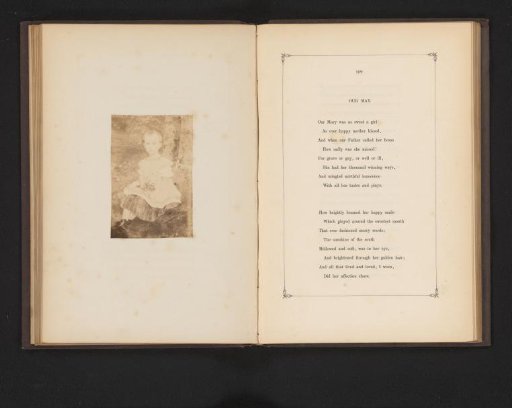 Portrait of an unknown girl, labeled as May, with flowers
