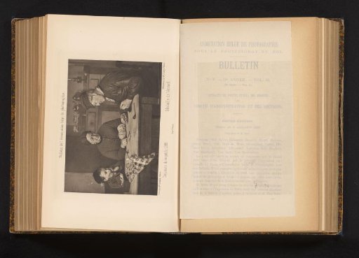 Peasant family at table counting wages and mending clothes