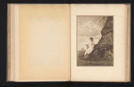 Woman seated on the root of a tree