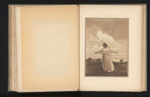 Woman with outstretched arms in a landscape