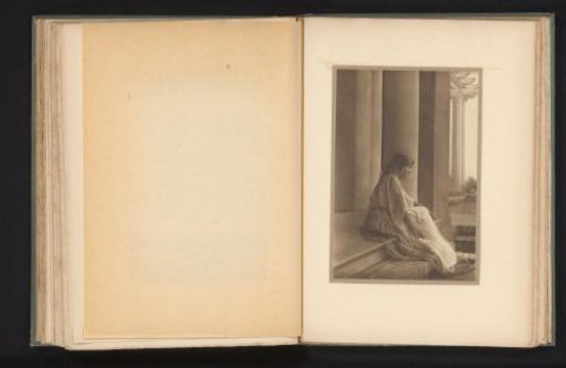 Woman seated on the step of a temple portal