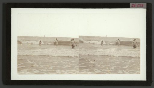 Men in swimwear in the surf