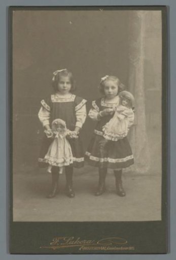 Portrait of Two Unknown Girls with Dolls