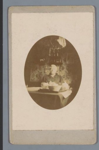 Portrait of an Unknown Woman, Seated Behind a Table with Tableware