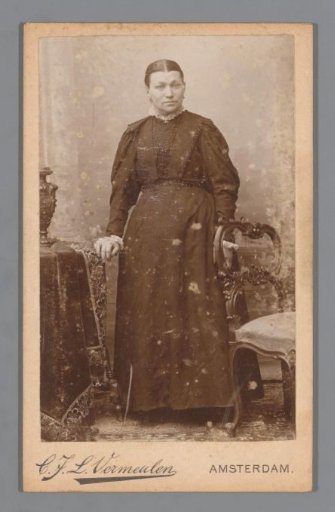 Portrait of an Unknown Woman, Standing Next to a Chair and a Table