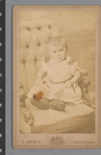 Portrait of an unknown baby on a chair