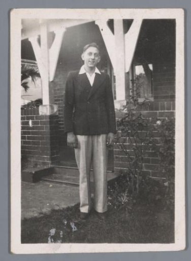 Portrait of an unknown man in a front garden