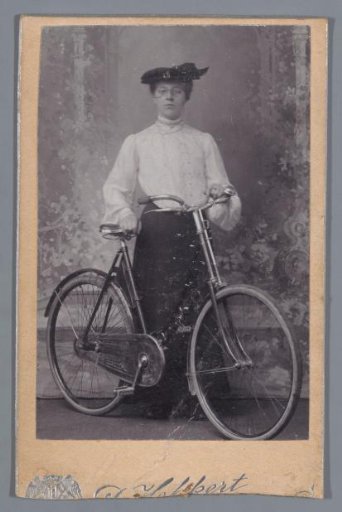 Portrait of an unknown woman with a bicycle