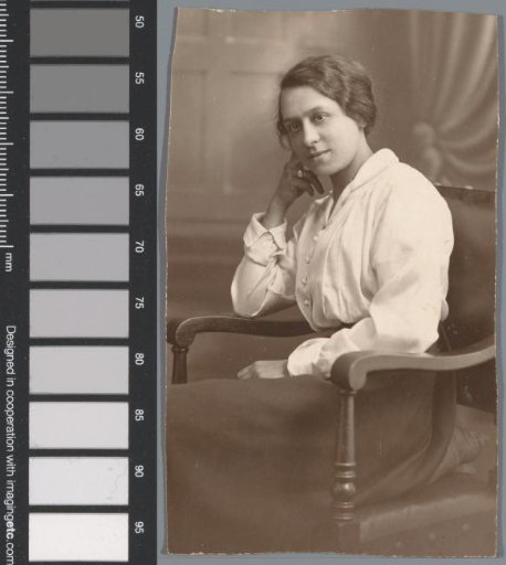 Portrait of an unknown woman seated on a chair