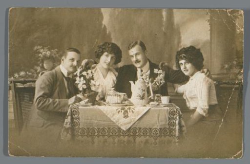 Portrait of Four Unknown People Around a Table
