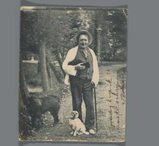 Portrait of an unknown man with two dogs and a cat