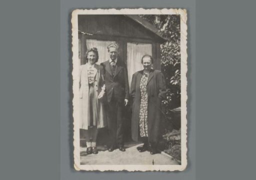 Group portrait of an unknown young woman, young man and woman