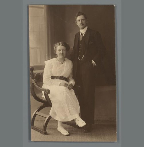 Portrait of an unknown man and woman in a photography studio, identified as the Jorna family