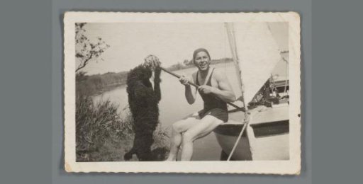 Sierk Noordhoff with a Dog Sitting on a Sailboat