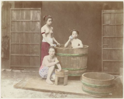 Three Women Bathing in a Bathtub