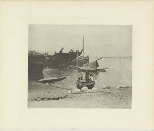 View of Several Unrigged Ships and a Boat with Three Children on a Coast in Great Britain