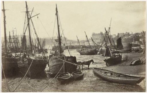 View of the Harbour of Scarborough, with some ships on the beach in the foreground