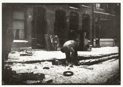 Construction Worker at Work in the Snow in Amsterdam