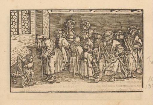 Father in a large chair surrounded by family