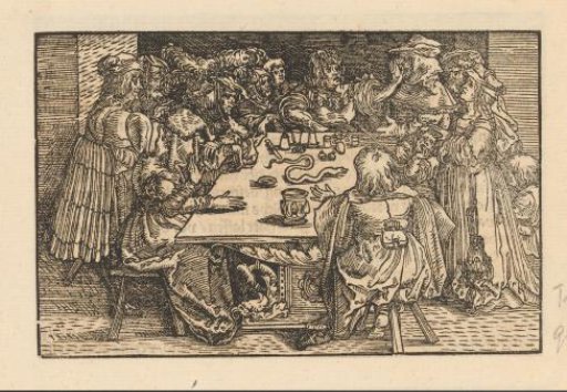 Magician entertaining his audience at a table