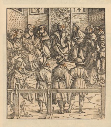 Men in a council chamber