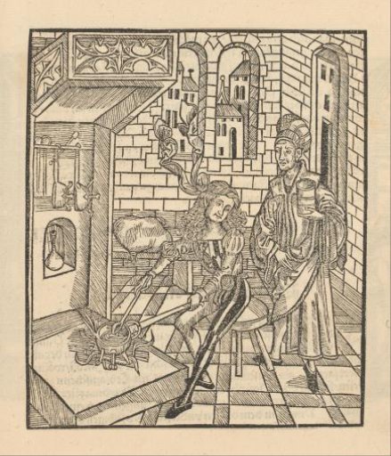 Two men at a cooking fire