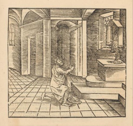 Praying man at a small altar