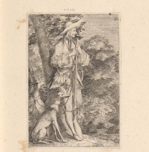 Hunter with two dogs at the edge of a forest
