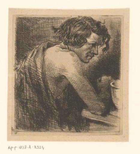 Young man leaning with his bare right arm on a table