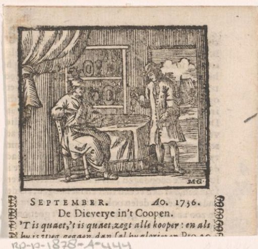 Young man buying a necklace from a man sitting opposite him