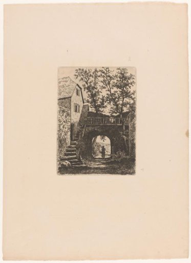 House with a staircase alongside a gate