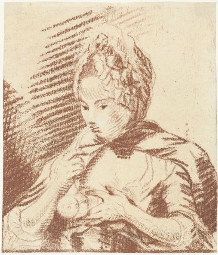 Young mother feeds her child with a feeding bottle