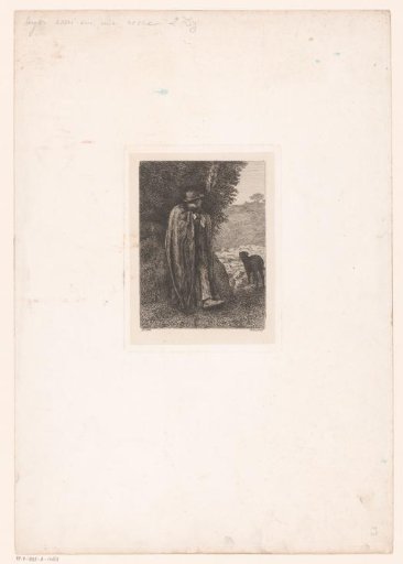 Shepherd with dog leaning against a rock