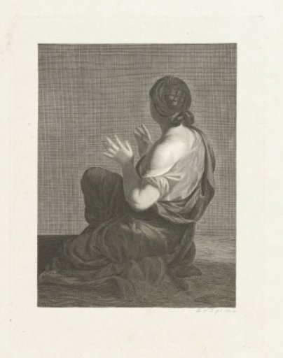 Seated woman seen from behind