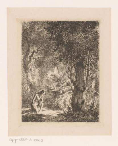 Man kneeling in a wood by a memorial site