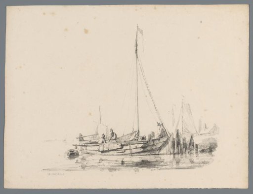 Sailing boat at the water's edge with two figures