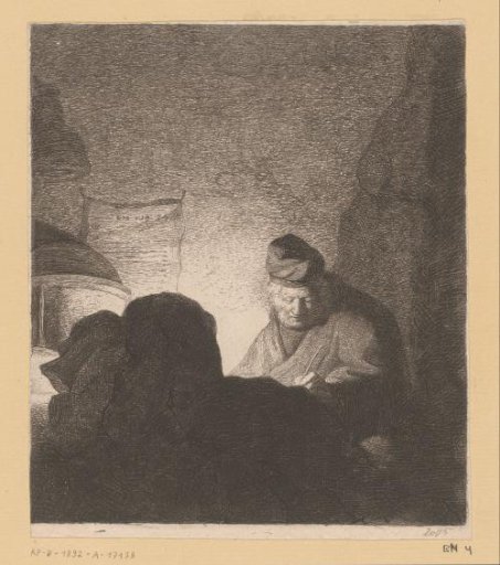 Man writing in the light of a lamp