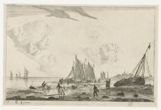 Beach with a sailing ship drawn up on the sand