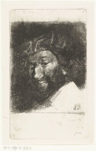 Portrait of a smiling man with beard and cap