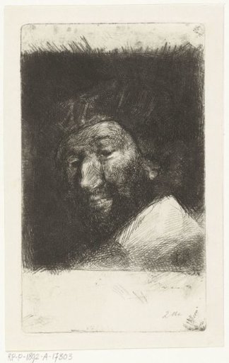 Portrait of a smiling man with beard and cap