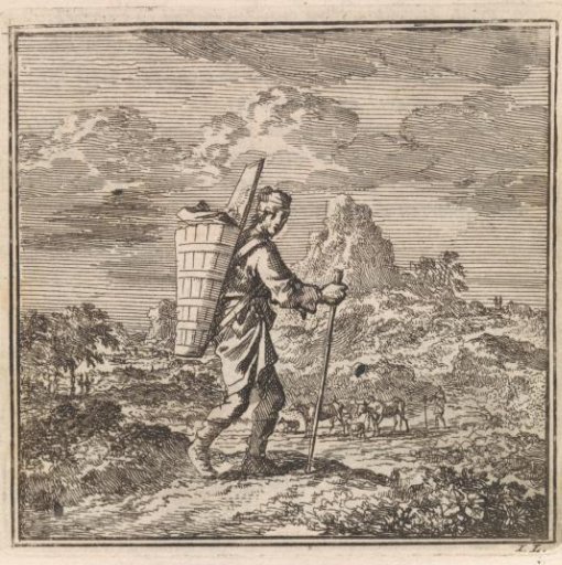 Hiker with a staff and carrying basket in a hilly landscape