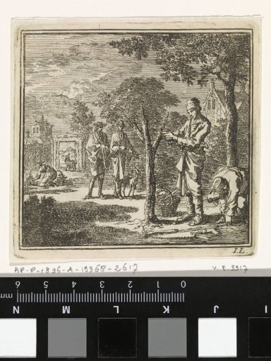 In a garden a man busy with grafting