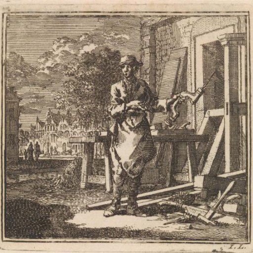 Carpenter pointing to the drill he holds in his hand