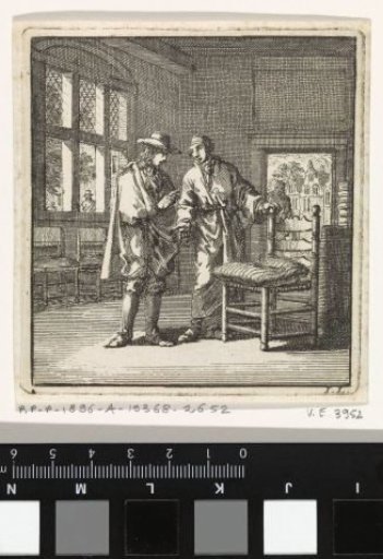 A man showing a chair with a rush seat and a cushion to another man