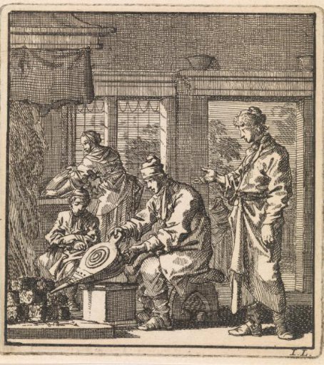 Man stoking the fire with a bellows